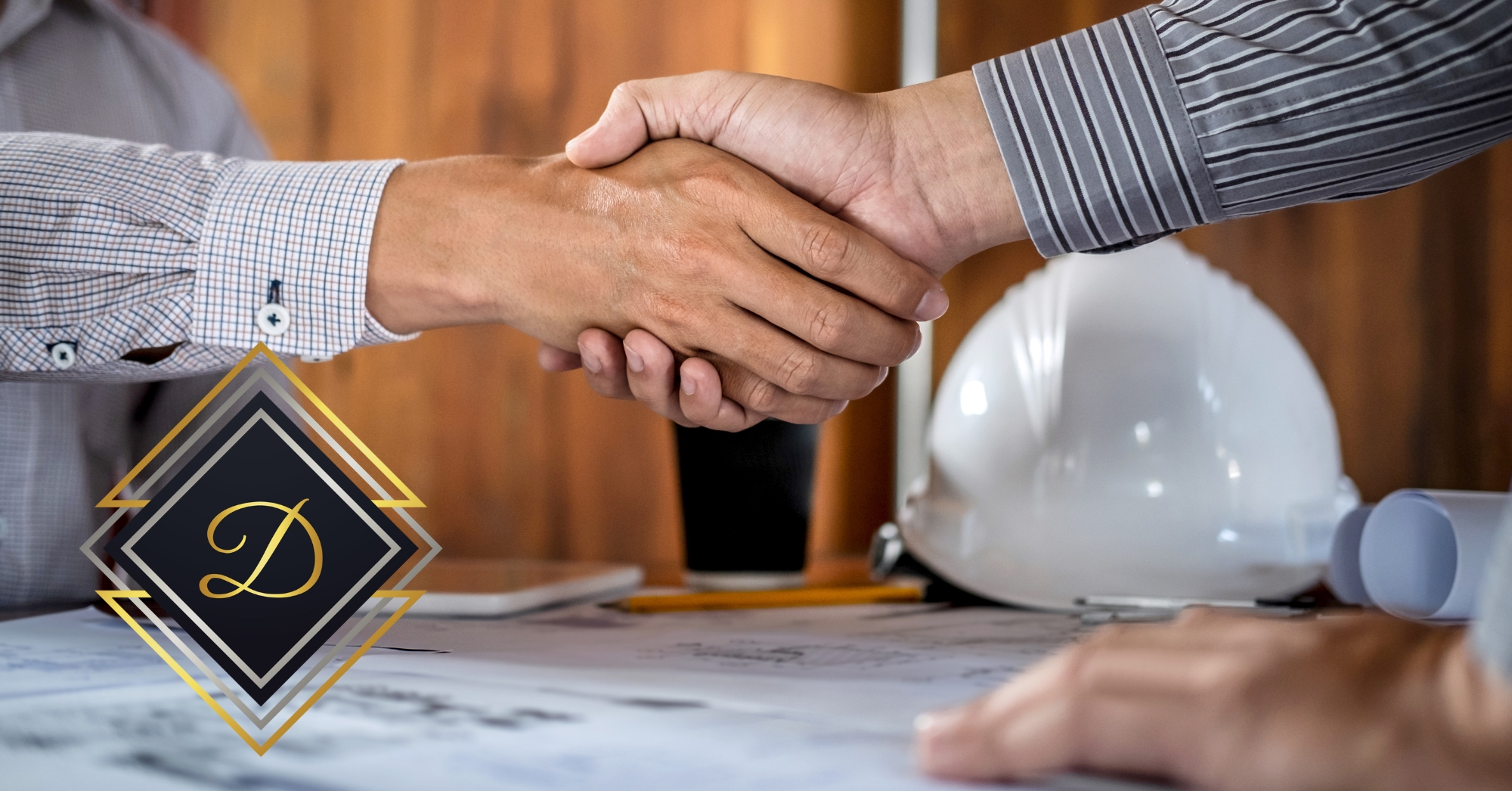 Down East Granite September Blog Post image on why builders choose us. Two people shaking hands over blueprints.